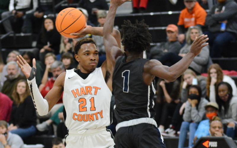 Sunshot by Michael Hall — Hart County’s Shone Webb pulls the ball back from an Elbert County defender at Hart County High School on Dec. 16 in the Bulldogs’ first win of the week over the rival Blue Devils.