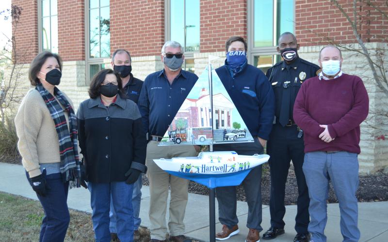 Sunshot by Drew Dotson - Pictured from left to right are Angela Short, Debbie Gurley, Dennis White, Ken Lystiuk, Jon Herschell, Anthony Davis and Jason Ford.
