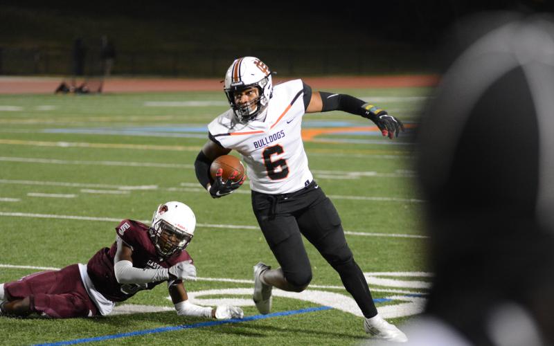 Malachi Kelley tries to evade a Carver defender Friday in Atlanta.