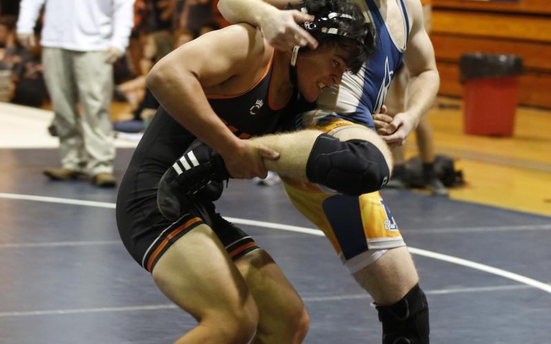 Photo by Rose Scoggins - Logan Lopez tries to take down his opponent Tuesday, Dec. 1 in Elbert County.