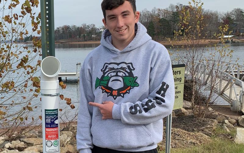 Photo submitted — Dawson Carden shows off one of the monofilmanet recycling stations he has placed at boat ramps around Lake Hartwell.