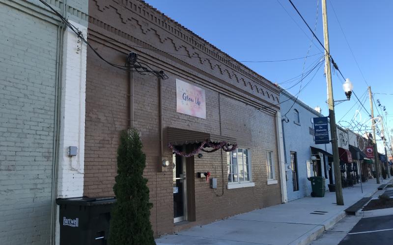 Sunshot by Drew Dotson - The exterior of Glow Up Tanning Salon is shown on Depot Street in downtown Hartwell.