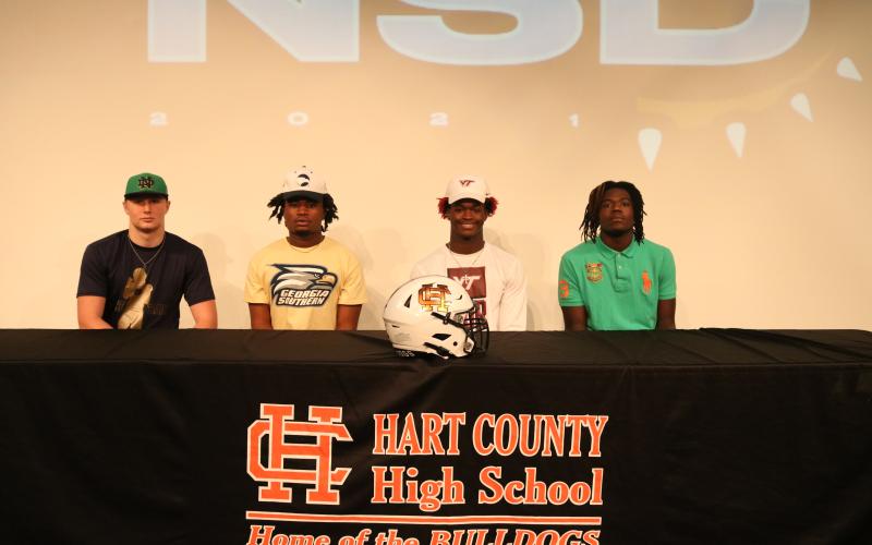 Sunshot by Grayson Williams — Cane Berrong, from left to right, Montae Maxwell, Malachi Thomas and Xavier Brown, after signing letters of intent to play football in college.