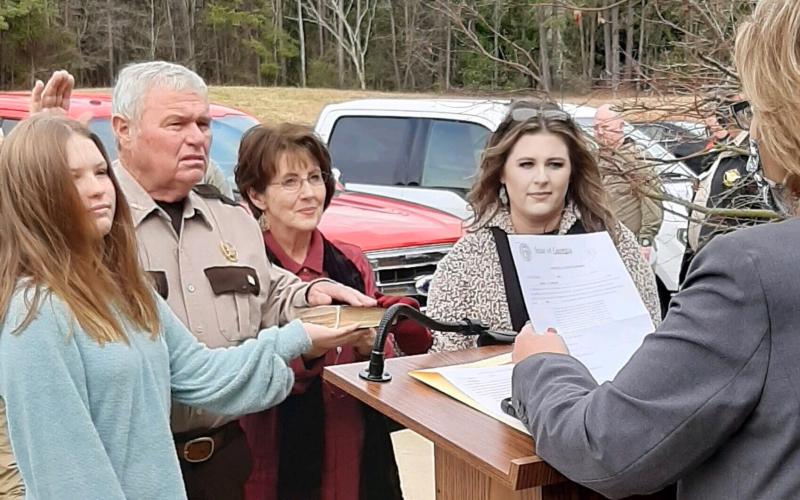 Pictured are, second from left, Cleveland, alongside, left, granddaughter Natalie Jo Morris, second from right, wife Coni Jo Cleveland, and, right, daughter Madison Morris.