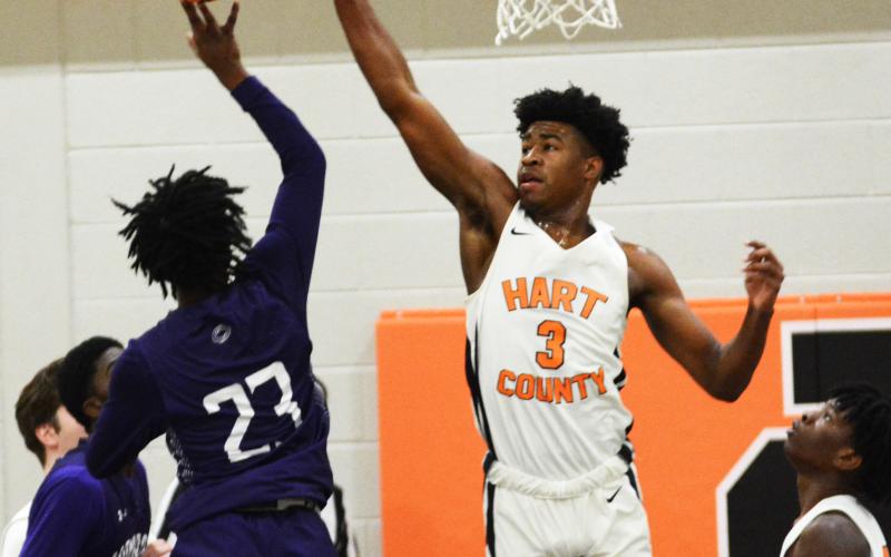 Sunshot by Michael Hall Hart County’s Tahj Johnson blocks a shot by a Monroe Area player at Hart County High School on Friday, Jan. 8, in the Bulldogs’ first region win of the season.