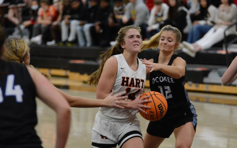 Sunshot by Grayson Williams - Dakota Phillips powers through Oconee County Defenders at Hart County High School on Friday, Jan. 22.