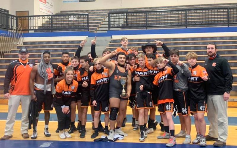 Photo by Mandy Patton - The Hart County High School wrestling team celebrates the school’s first region championship in duals wrestling in school history on Jan. 16 at Oconee County High School.