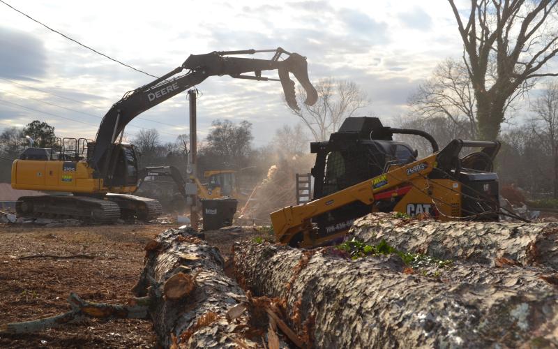 Sunshot by Drew Dotson - Workers use heavy equipment to clear the land at 55 Ridge Road to make way for two buildings that will house two new businesses.