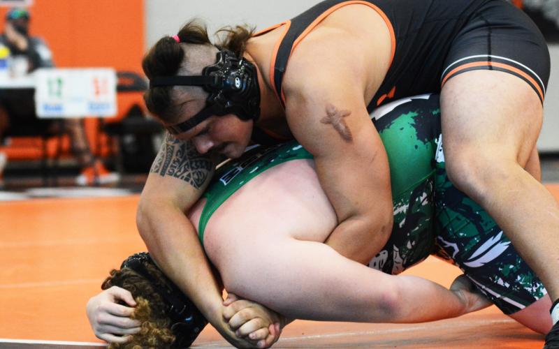 Sunshot by Michael Hall - Damien “D-Roc” Tyler holds down a Murray County opponent in a quick victory on Saturday at Hart County High School.