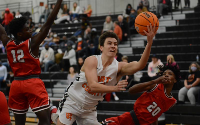 Sunshot by Grayson Williams - Ethan Spagnoli puts up a shot against Stephens County at Hart County High School on Tuesday.
