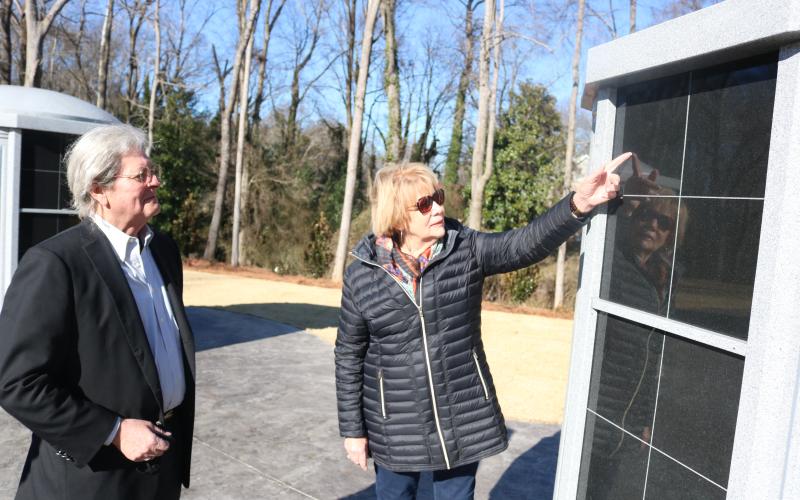 Walter Gordon, left, and Nancy Hardigree, right, look at the new columbarium at Northview Cemetery placed there as part of a beautification project at the historic cemetery.