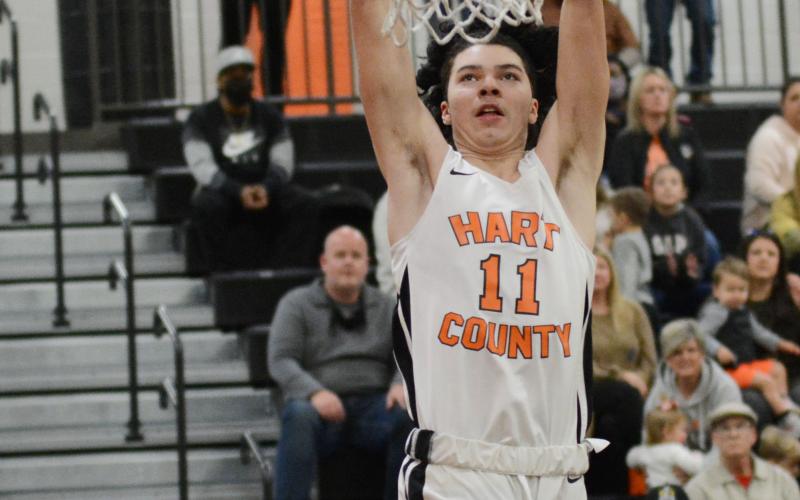 J.C. Curry dunks the ball against Monroe Area on Saturday, Feb. 20, at Hart County High School in the Bulldogs’ 61-52 win over Monroe Area in the Region 8-AAA championship game.