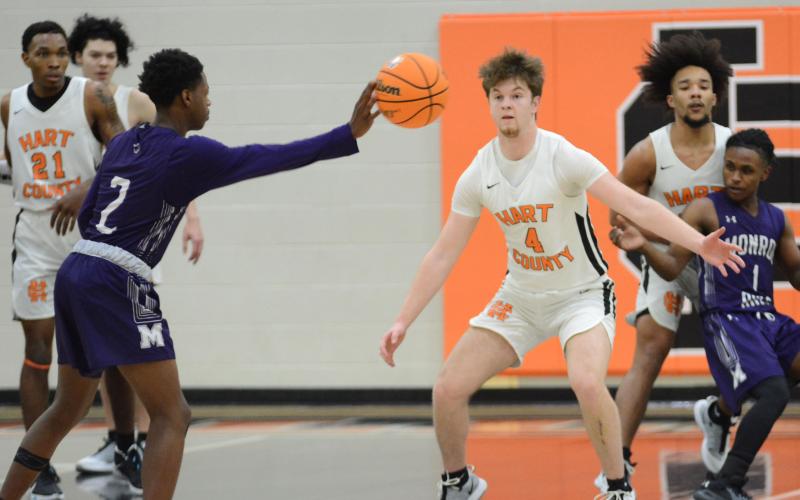 Ben Edwards, No. 4, plays defense on Saturday, Feb. 20, in the Bulldogs’ Region 8-AAA championship win over Monroe Area.