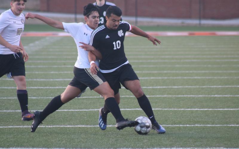 Sunshot by Grayson Williams Renso Escobedo battles for possession with a Commerce player at Hart County High School on Monday, Feb. 8.