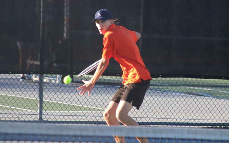 C.J. Jorensen returns a volley during a match against Habersham Central on Monday, Feb. 22, at HCHS.