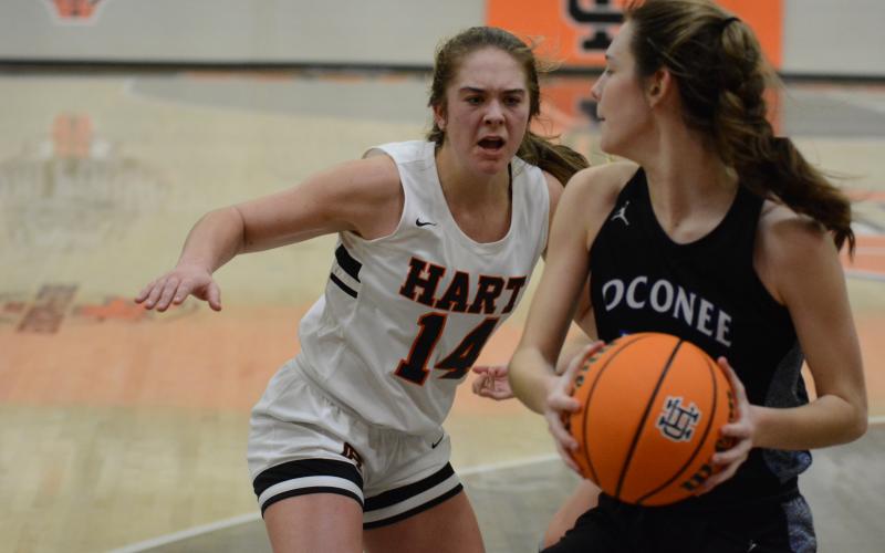 Sunshot by Grayson Williams - Dakota Phillips goes for the ball against an Oconee County player on Monday, Feb. 15, at Hart County High School.