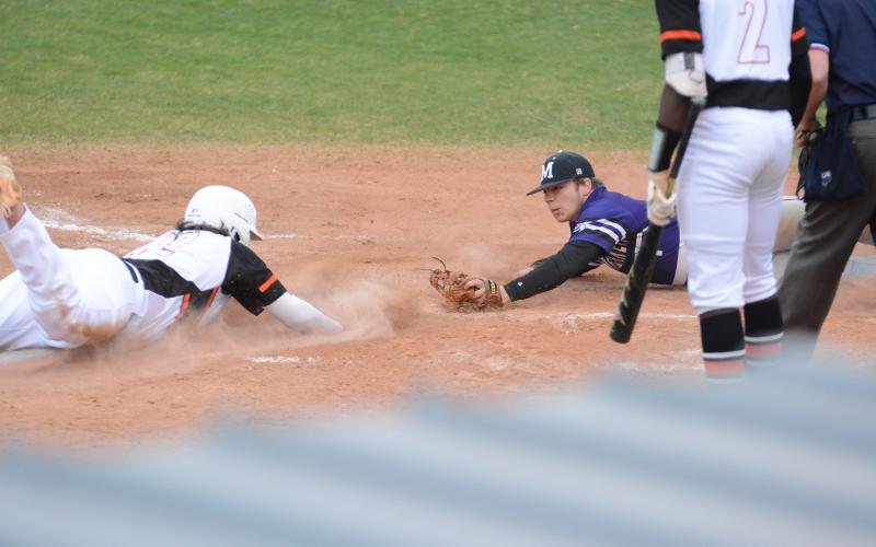 Sunshots by Grayson Williams - Will Dean slides into homeplate to score a run on March 15, at Hart County High School in the Hart County Diamond Dogs’ 15-0 win over Monroe Area.