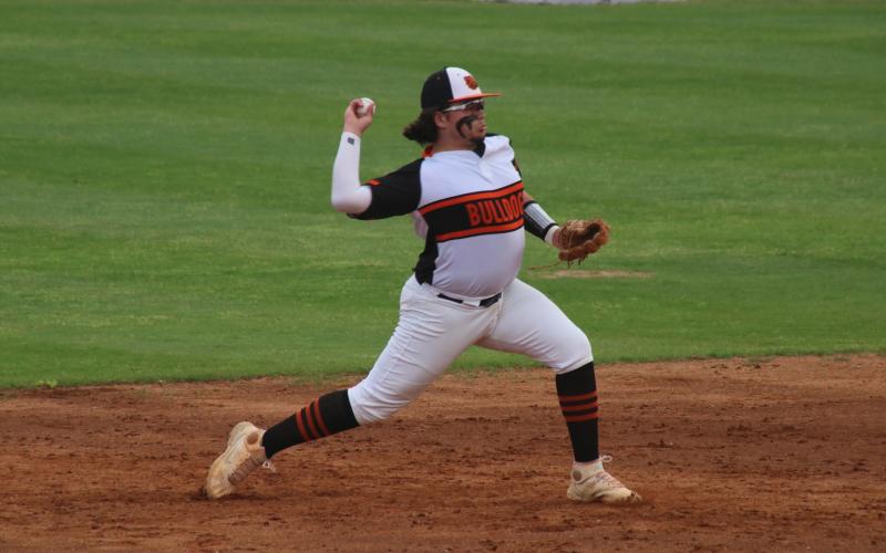 Will Dean fires a throw to first base for an out against Franklin County.