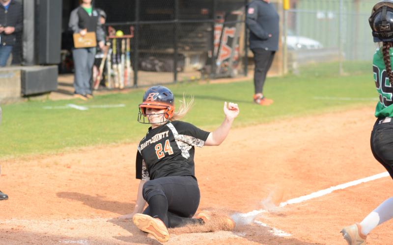 “Boo” Mitchell slides into home plate in the softball team’s victory over rival Franklin County.