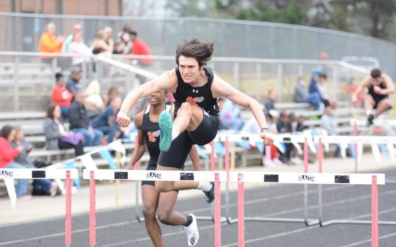 Sunshot by Grayson Williams - Justin Coker competes in the 110-meter hurdles at Hart County High School on Monday, March 15.