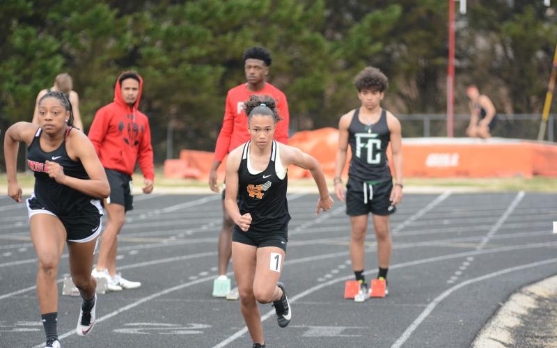 Kiera Jester competes in the 100-yard dash in the girls’ track team’s 1st-place finish.