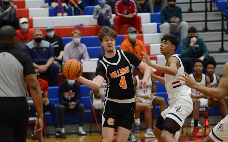 Ben Edwards tries to find an open teammate against Sandy Creek on March 5.
