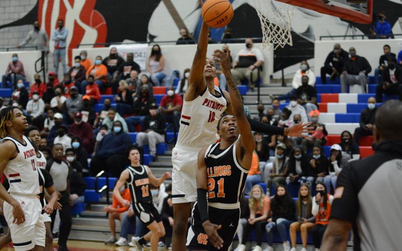 Sunshots by Grayson Williams - Hart County’s Shone “Spudd” Webb is blocked in a layup attempt on Friday, March 5, by Sandy Creek’s Jabari Smith, who is committed to play at Auburn in college.
