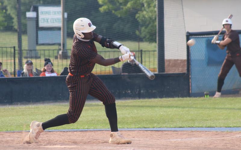 Sunshot by Grayson Williams - Paul Davis makes contact with a pitch on Friday, April 23 against Oconee County in Watkinsville.