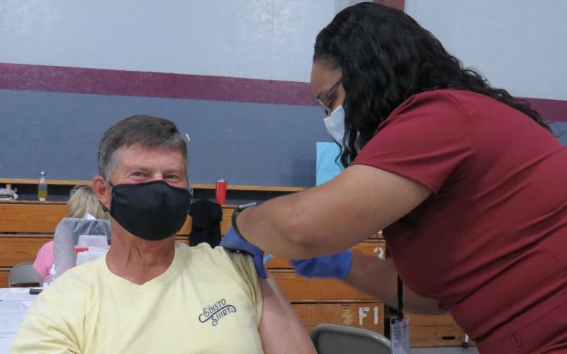 Photo submitted - Local resident Joby Scroggs receives his second Moderna vaccine from nurse Theresa Curry.