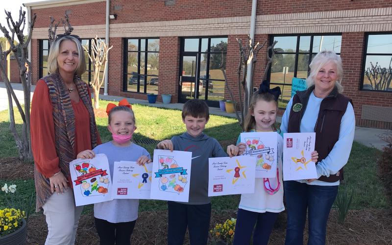 Submitted photo Pictured: left to right in the Coloring Contest: Angela Wood, HCFB Office Manager, 1st place – Bailey Driscoll, 2nd - Grayson Morris, 3rd – Millie Colson and Patti York, HCFB Women’s Committee Chair.