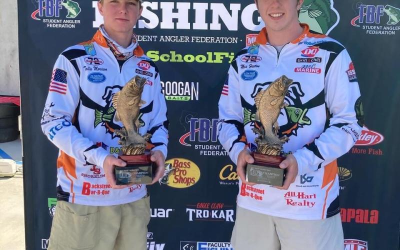 Photo submitted - Tallis Morrison, pictured left, and Max Heaton, right, pose for a photo with their first-place tropies after winning the Student Angler Federation’s regional qualifer over the weekend on Lake Hartwell.