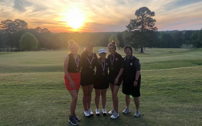 Photo submitted Pictured from left to right are Hart County High School girls’ golf team members Ashlyn Stanton, Mary Elizabeth Jackson, Lauren Weaver, Ella Franklin and head coach Wende Peloquin at the area tournament on Monday in Monroe.