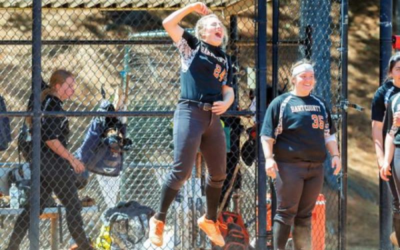 Anslee “Boo” Mitchell raises a fist and shouts in celebration at the slow-pitch softball state tournament last week in Woodstock.