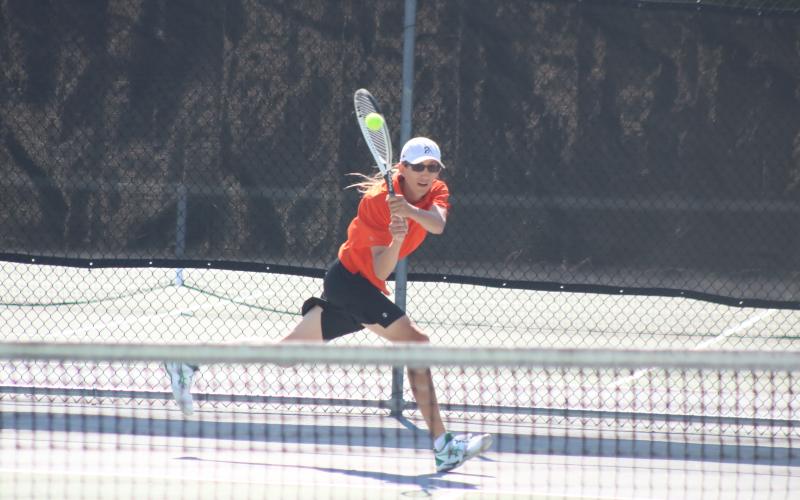 Grayson Williams/The Hartwell Sun C.J. Jorensen returns a serve against Sandy Creek at Hart County High School in the Racket Dogs’ first-round playoff victory on April 19.