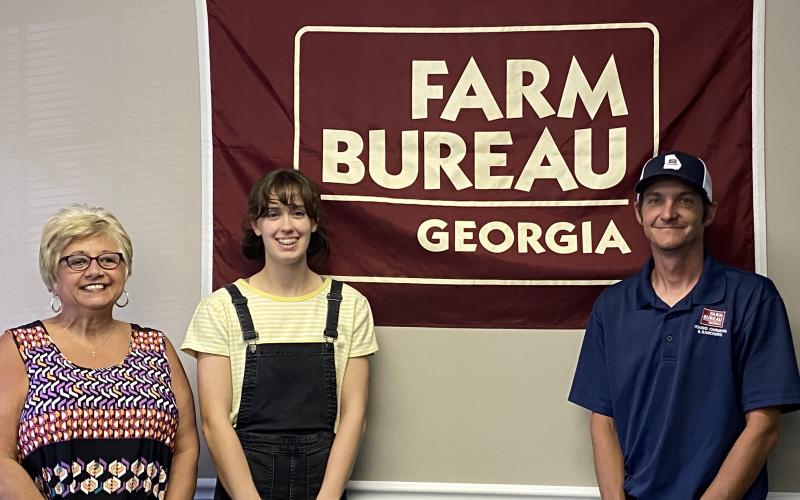 Submitted photo - From left to right, Farm Bureau office manager Tina Simmons, award winner Sydney Smith and Young Farmer &amp; Rancher chairman Brian Fleming.