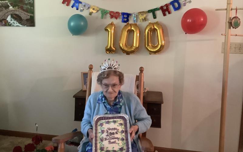 Submitted photo - Longtime area resident Pearl Bond celebrates her birthday with a cake from her friends who threw her a neighborhood party attended by about 30.
