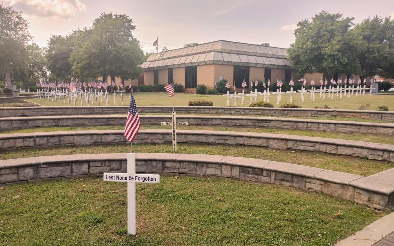 Dan Hunt/The Hartwell Sun - Crosses placed in memory of fallen area veterans line the front of the Hartwell courthouse in recognition of Memorial Day.