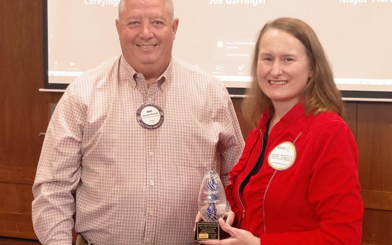 Dan Hunt/The Hartwell Sun - Ruth Daniel (right) receives the rare Service Above Self Award from Rotary president Mike Everett at Cateechee Golf Club on May 5.