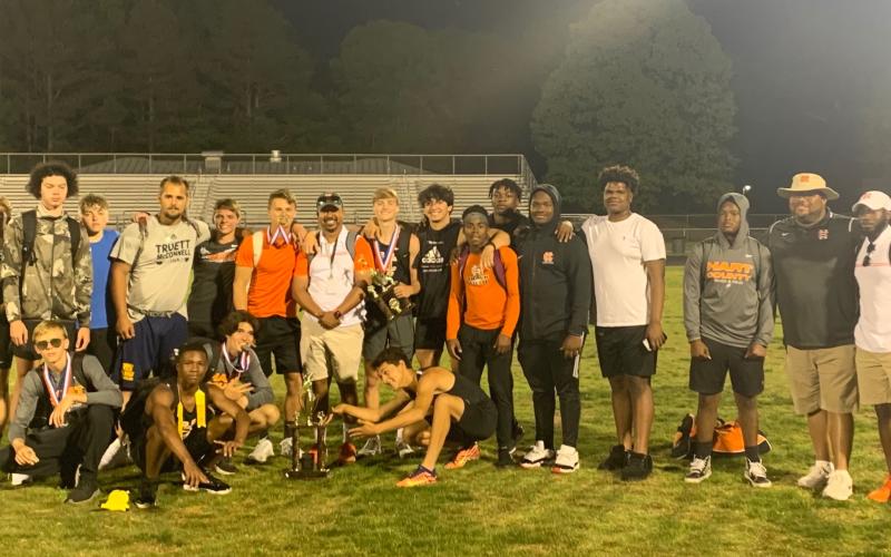 Photo submitted The Hart County High School boys’ track team is pictured with the Region 8-AAA trophy after taking the title in Monroe last week.