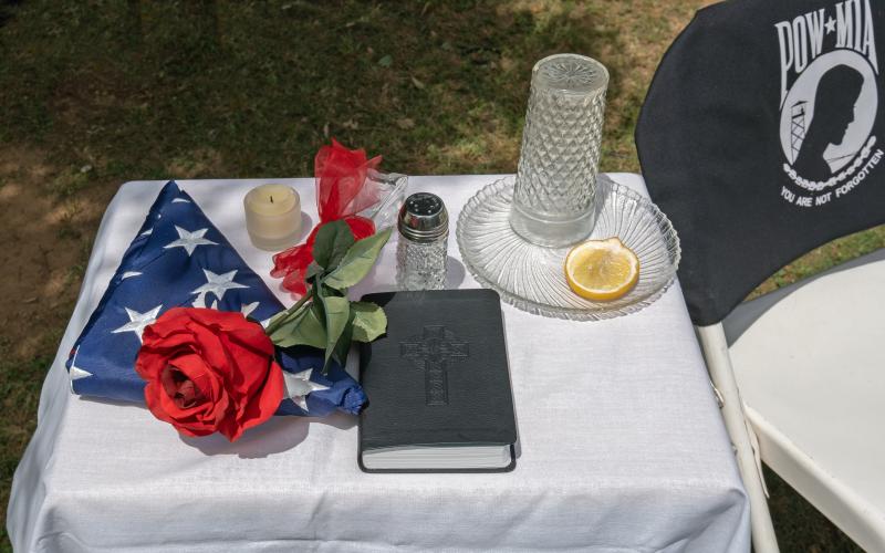 Bill Powell/The Hartwell Sun - A table set for one was placed in front of the speakers Monday to symbolize hope and remembrance for those missing in action.