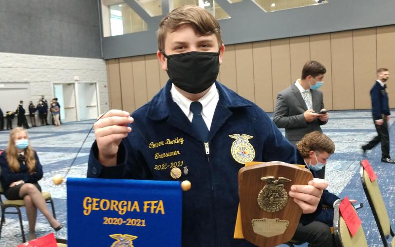 Conner Bentley displays his awards at the Georgia State FFA Lawnmower Operation and Maintenance Career Development Event.