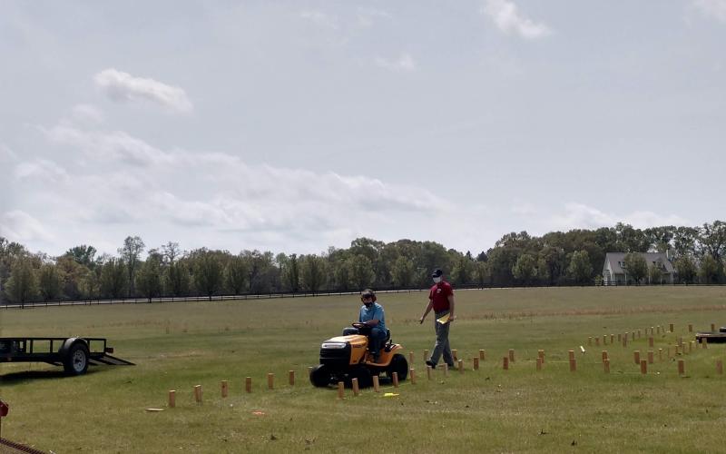 Bentley competes in the lawnmowing portion of the competition.