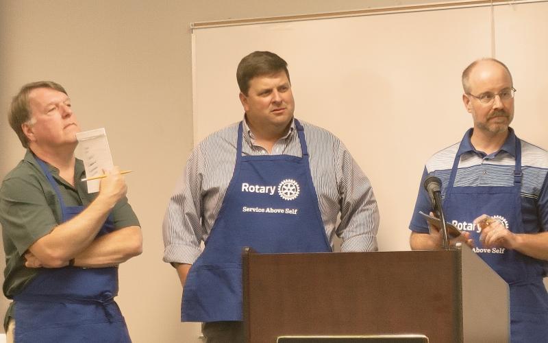 Dan Hunt/The Hartwell Sun - Jon Herschell and Brian Metzger from the Rotary spelling bee team listen to their next word assignment at the Hart County Adult Learning Center on June 17.