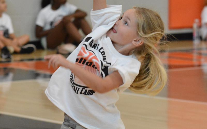 Nora Gibbs throws up a shot in the “hot shot” competition.