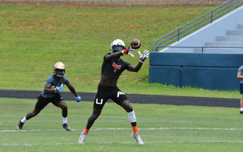 Drew Dotson/The Hartwell Sun - Paul Davis catches a pass in the semi-finals of the 7-on-7 camp in Cleveland against St. Pius X Catholic School.