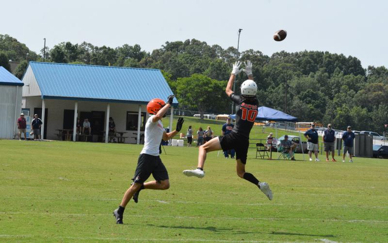 Tanner Ayers flies above the defender to snag a pass.