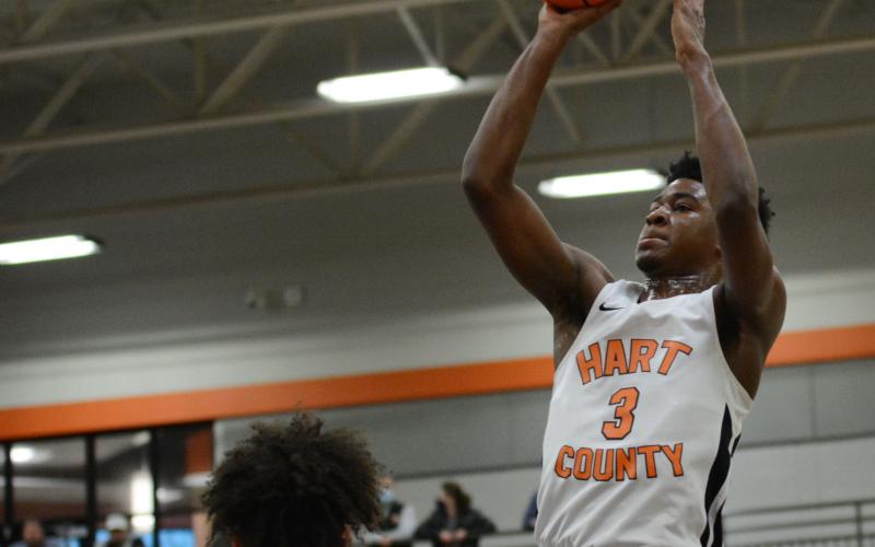 From File - Tahj Johnson pulls up for the jump shot against Cherokee Bluff on Feb. 27, 2021.