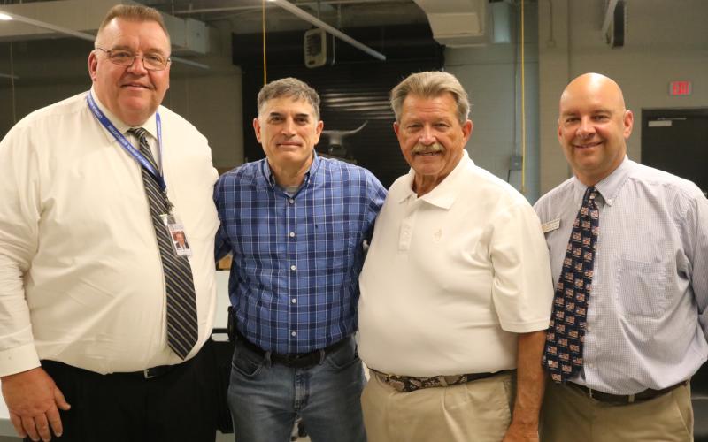 Photo submitted Pictured left to right: Hart County superintendant Jay Floyd, Congressman Andrew Clyde, Ga. Rep. Alan Powell and Career Academy CEO Brooks Mewborn pose for a photo at the  Hart College and Career Academy.