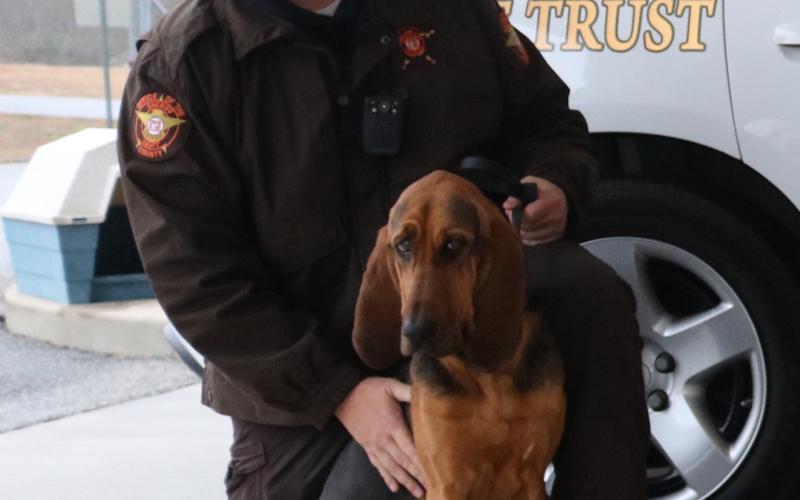 Deputy Jarod Tollison alongside K9 unit Parker Jean.