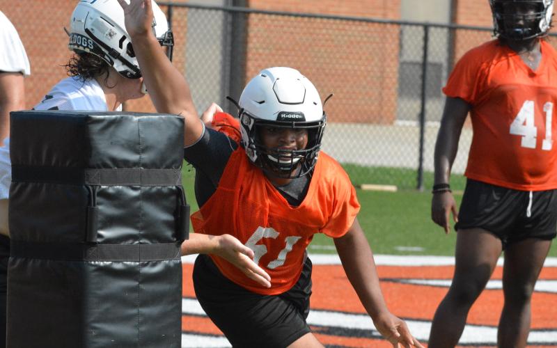 Lametris Verdell puts a move on an offensive lineman in a pass-rush drill.